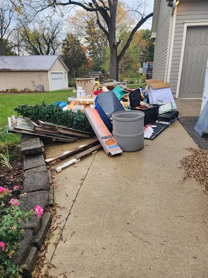 Dumpster being loaded with debris for 10 Yard Dumpster Rental in Upper Paxton